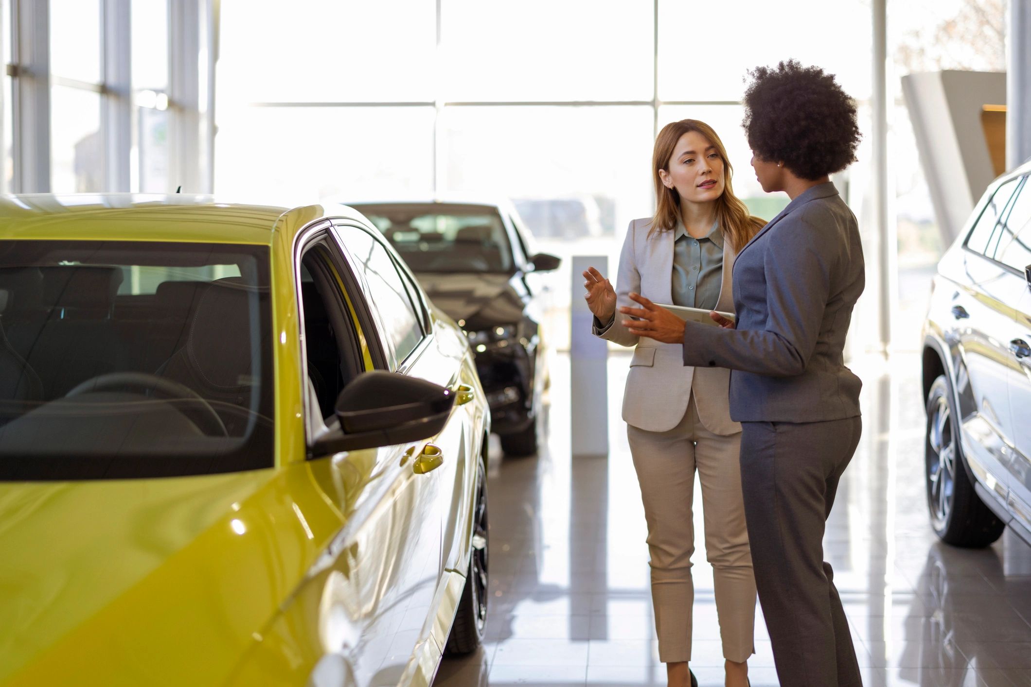 Dealer helping a customer explore vehicle options