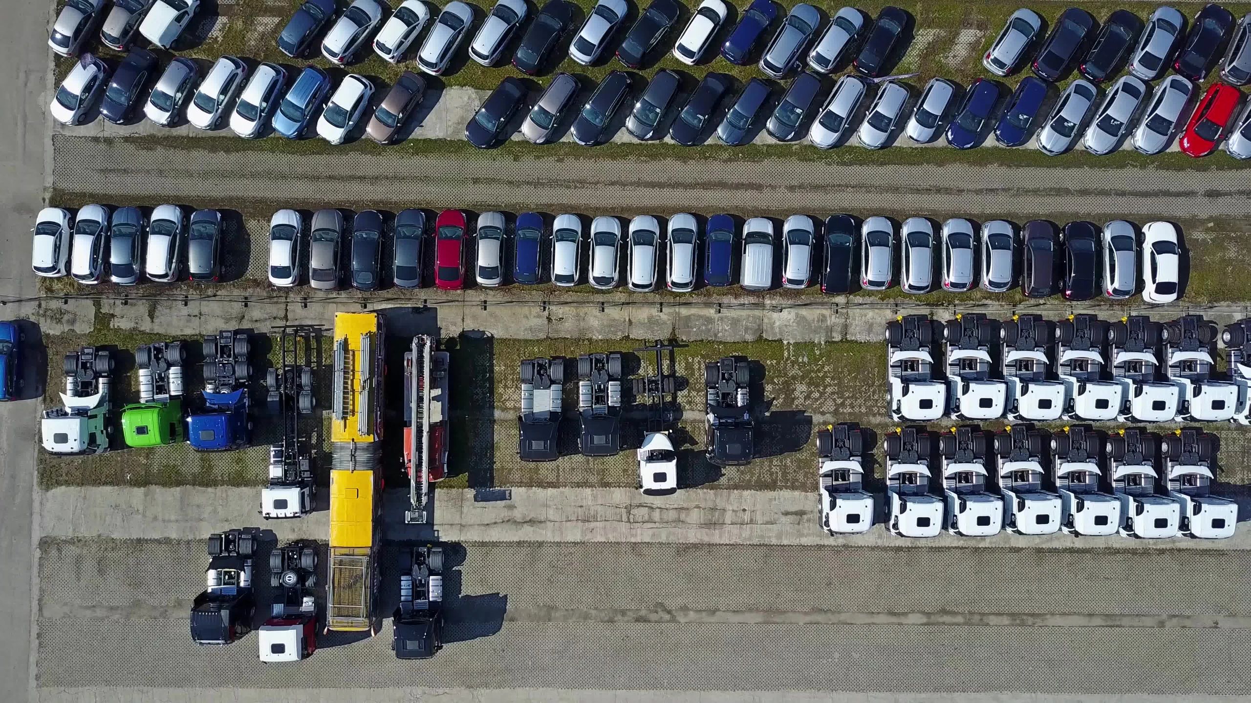 Cars and trucks in a vehicle storage lot
